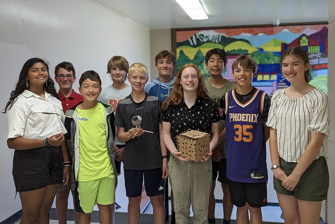 Kalispell Middle School students took first place, second place and honorable mention in the Biomimicry Youth Design Challenge. Pictured with their design models is (front row, left to right) Padmaja Vatti, Nick Neils, Bowman Carlson, Szonja Czinner, Bridger Sunde and Hilda Weber, (back row, left to right)  Roane Wiersma, Trevor Hammer, Kruz Robinson and Sachi Kameya. (Photo provided by Ashley Skare)