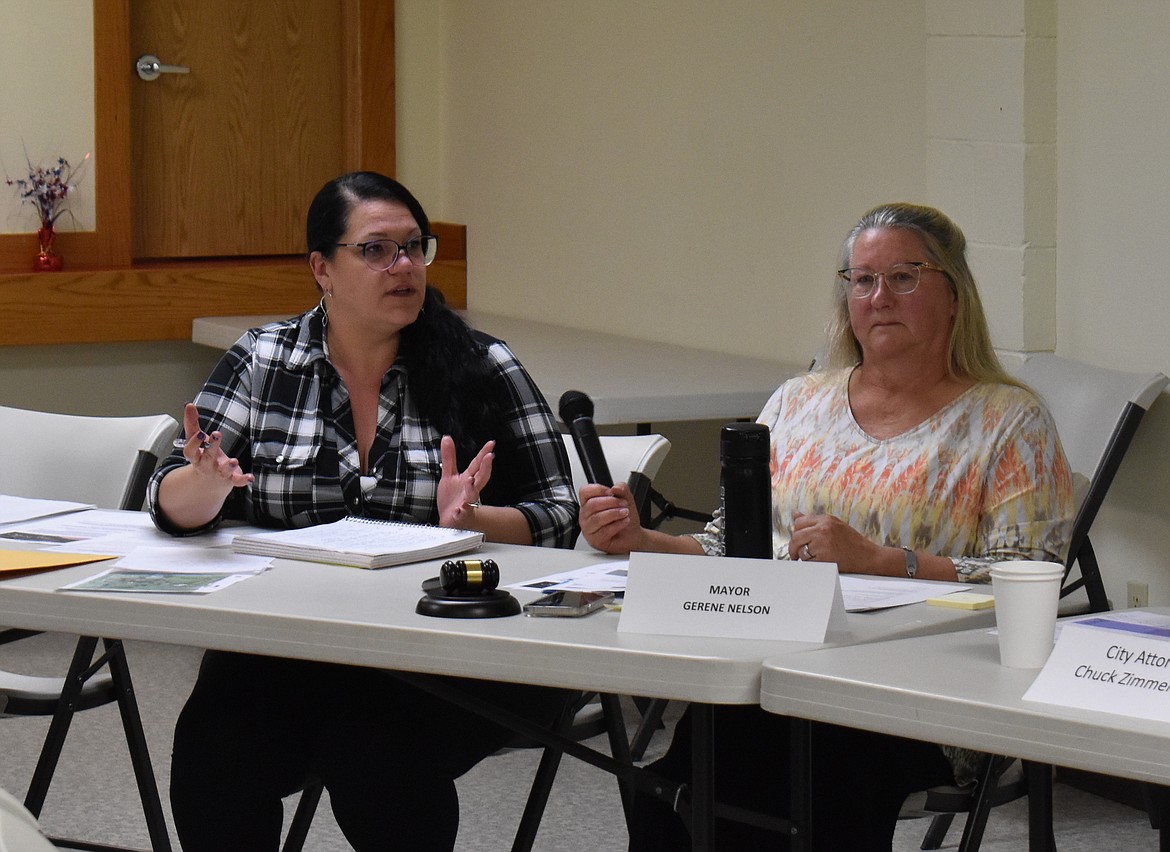 Newly-appointed George Clerk-Treasurer Amy Grace, left, speaks to Mayor Gerene Nelson, right and the George City Council at the council’s meeting Tuesday.