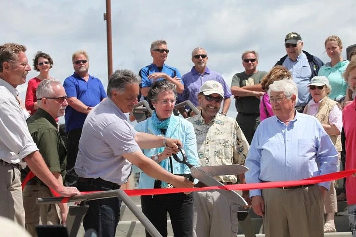 On May 24, 2014, the opening of McEuen Park, Mayor Steve Widmyer and former mayor Sandi Bloem cut the ribbon, while parks director Doug Eastwood, right of Bloem, watches.