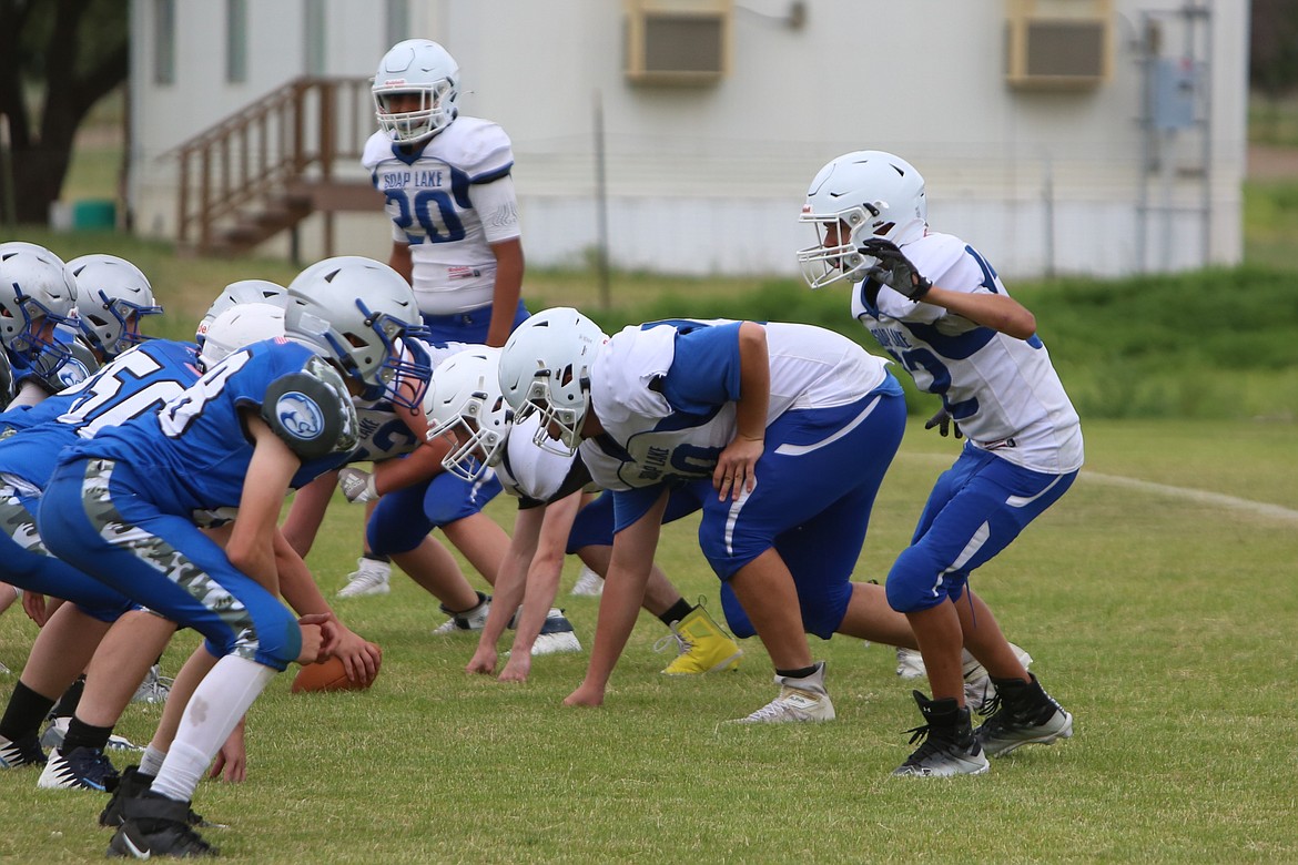 The Soap Lake defense lines up against the Curlew offense at Friday’s jamboree.