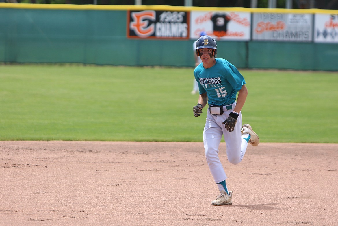 River Dog third baseman Anson Gustafson darts to third base against the North Spokane Dodgers on Sunday in Ephrata.