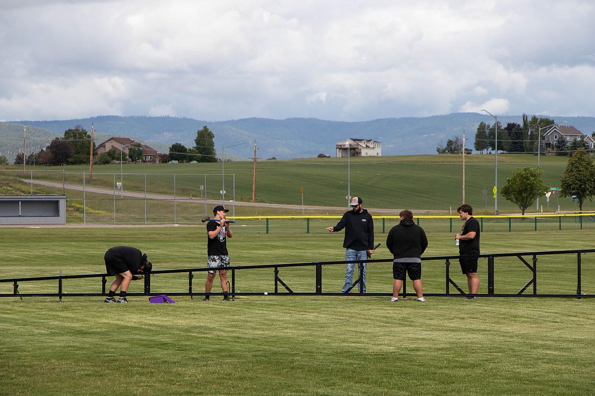 Volunteers assemble The Wall That Heals on June 21, 2023 at Glacier High School. (Kate Heston/Daily Inter Lake)