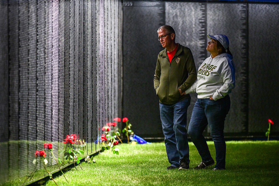 Dennis and Lorrie Bennett pay their respects at The Wall That Heals at the Glacier High School soccer fields on Thursday, June 22. (Casey Kreider/Daily Inter Lake)