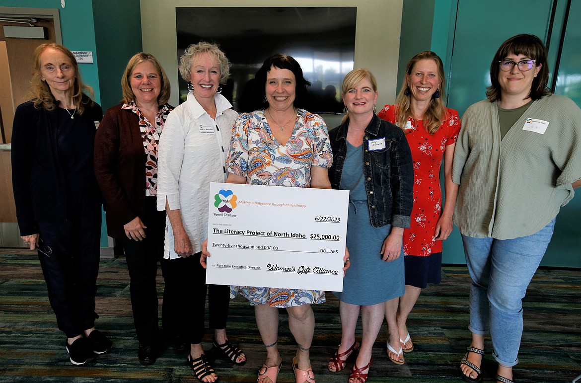 The Women's Gift Alliance presents $25,000 to the Literacy Project of North Idaho. From left, Laura Umthun, Joan Rock and Joan Woodard, all with WGA, Cat Gilmore, Literacy Project of North Idaho founder, Holly Edwards, Literacy Project, Maria Angel and Sam Gilmore.