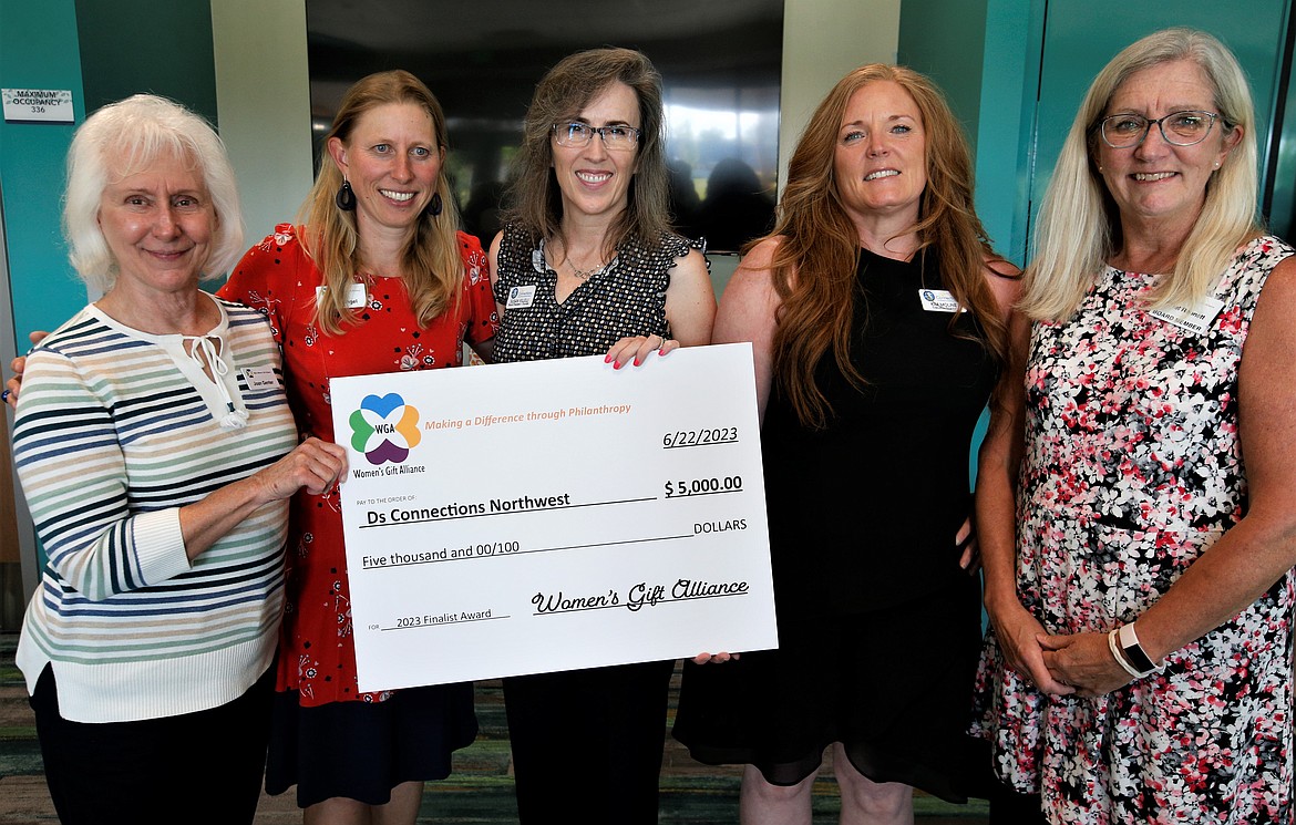 The Women's Gift Alliance presents $5,000 to Ds Connections Northwest on Thursday. From left, Joan Genter and Maria Angel, WGA; Susan Villelli, board president and founder of Ds Connections Northwest; Kim Moline, executive director, Ds Connections Northwest; and Janet Robnett, WGA.