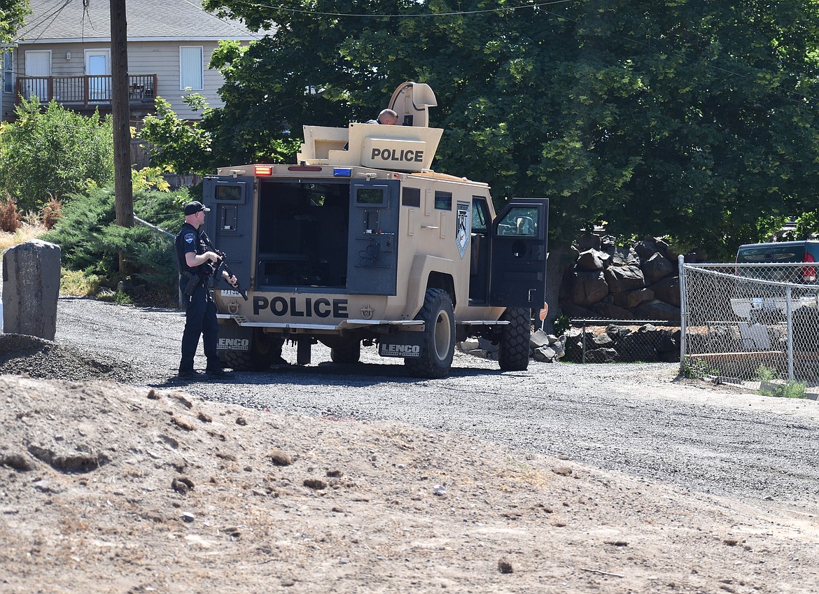 Moses Lake Police Department officers respond to a barricaded subject at a Moses Lake residence on Friday.