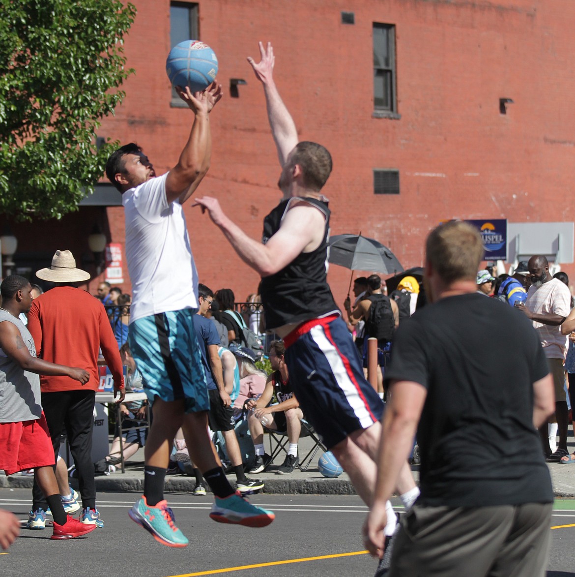 MARK NELKE/Press
Austin Allen of Pipe Squad puts up a shot Saturday at Hoopfest in downtown Spokane.