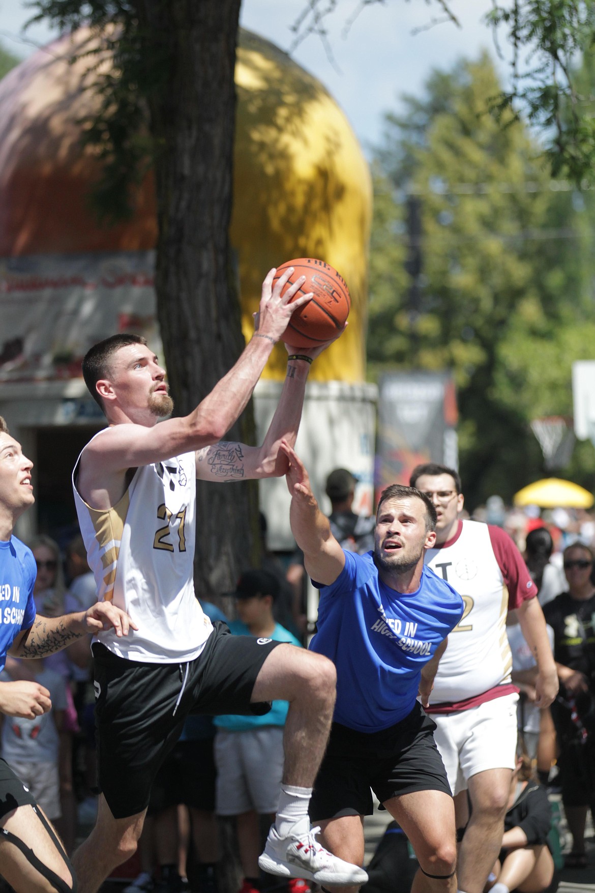 MARK NELKE/Press
Dalton Thompson of Quick Trigger goes up for a shot Saturday at Hoopfest in downtown Spokane.