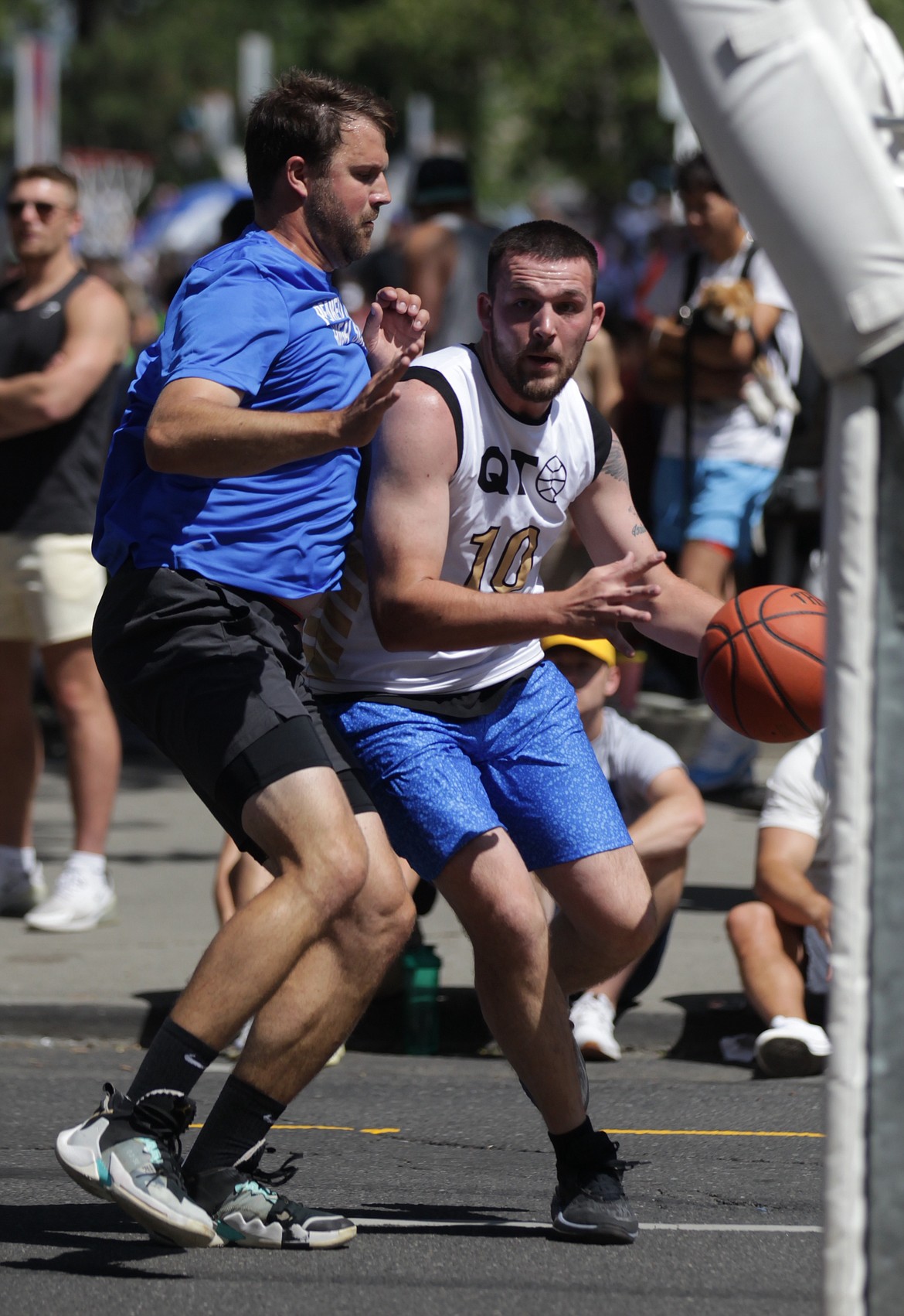 MARK NELKE/Press
Junior Williams (10) of Quick Trigger drives to the basket Saturday at Hoopfest in downtown Spokane.