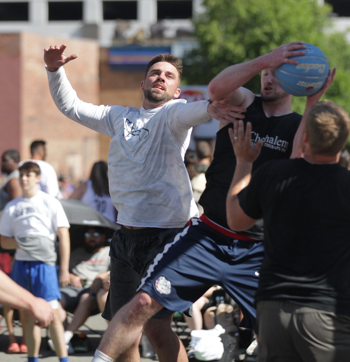 MARK NELKE/Press
Mason Cramer of Pipe Squad contests a rebound Saturday at Hoopfest in downtown Spokane.