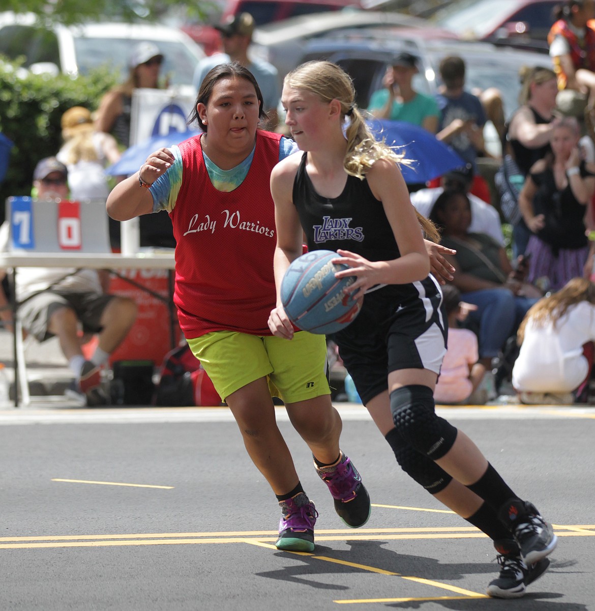 MARK NELKE/Press
Payton Brown of the Cd'A Lakers drives to the basket on Saturday at Hoopfest in downtown Spokane.