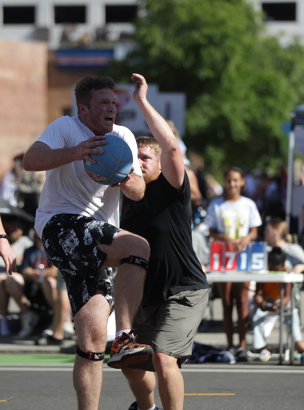 MARK NELKE/Press
Vance Kistler of Pipe Squad drives to the basket Saturday at Hoopfest in downtown Spokane.