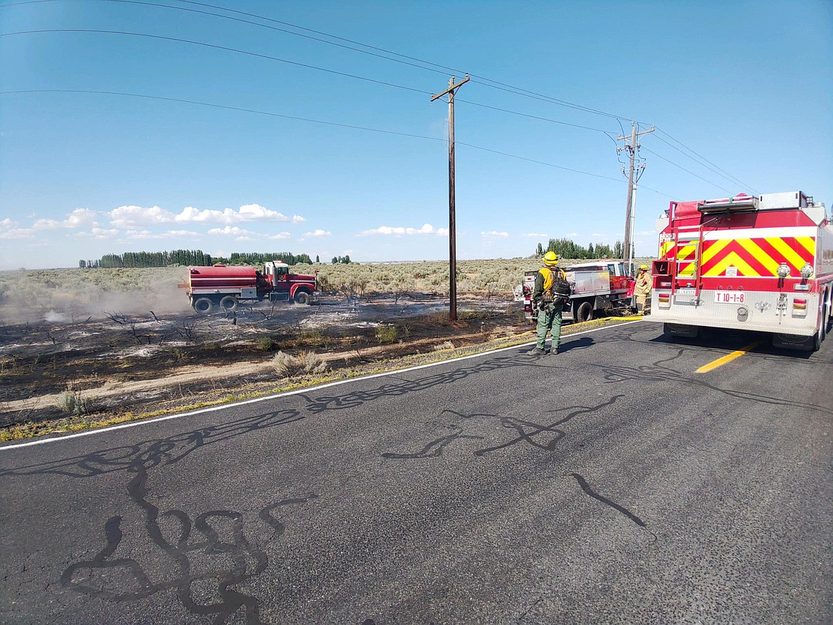 Royal Slope Fire Rescue and EMS fights a fire near Potholes State Park on Friday. The blaze caused a brief evacuation order, but only burned a small amount of acreage before it was put out and taken over by Bureau of Land Management staff.