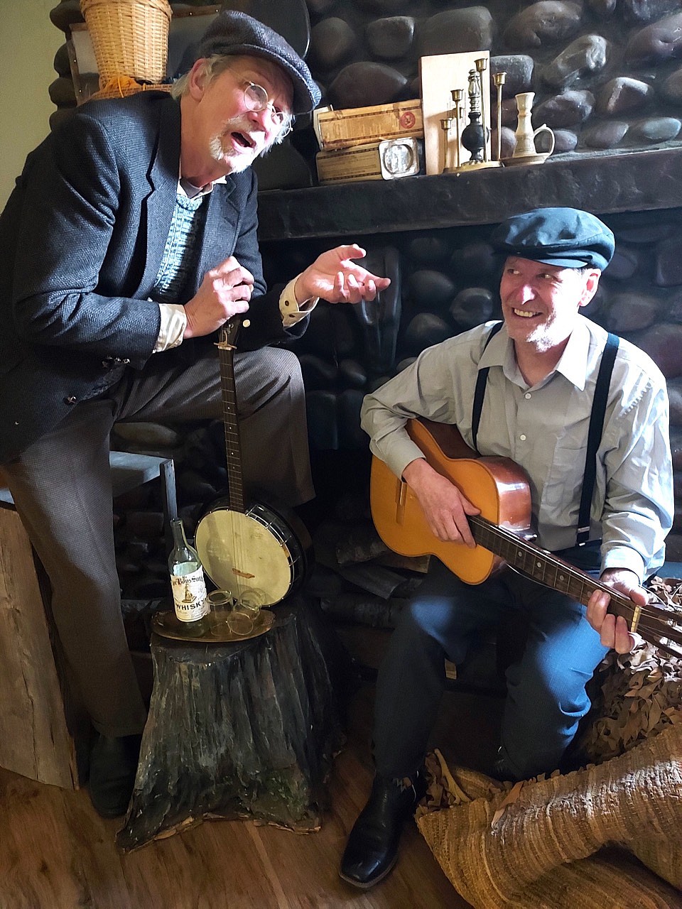 Cullan McGrath (Neal Lewing) and son Jack (Mike Gillpatrick) spin through a favorite Irish song in the Port Polson Players' season opener, "Carry Me O’er." (Karen Lewing photo)