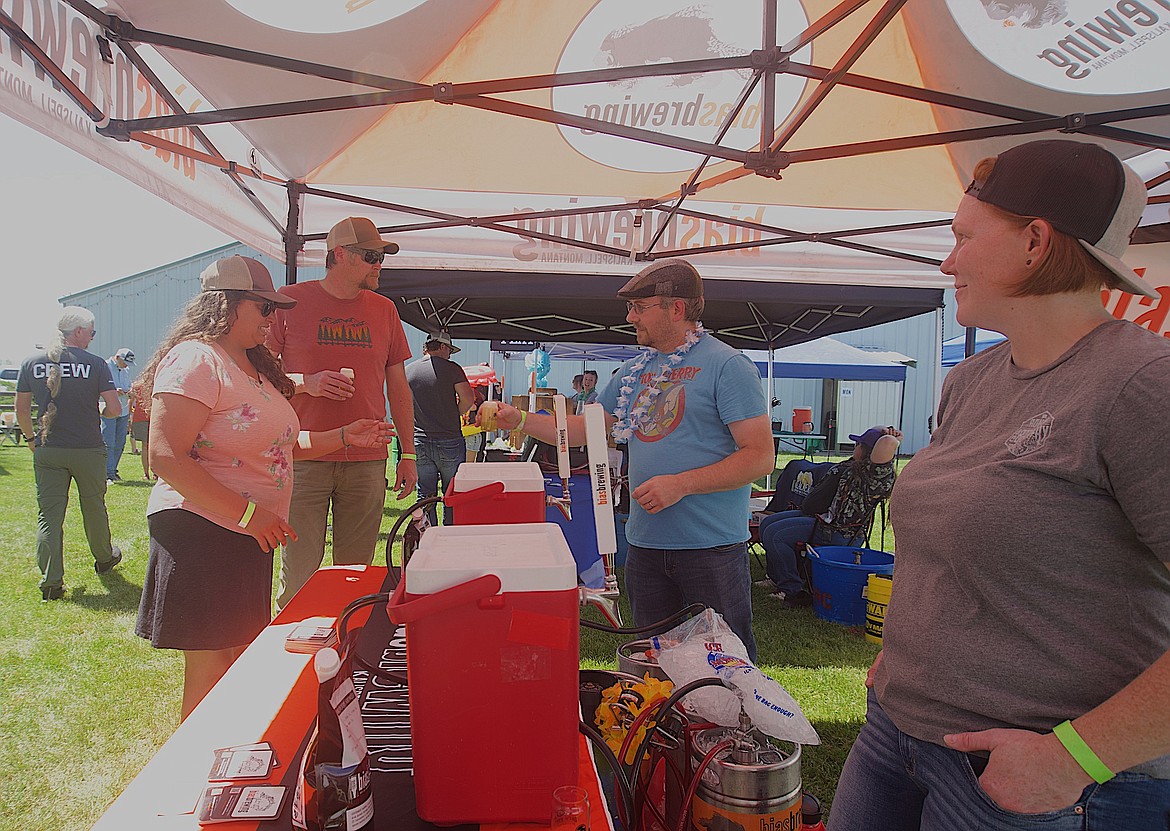 Josh and Christina Beisel of Bias Brewing in Kalispell said they enjoyed the friendly atmosphere at Saturday's Summer Solstice Brewfest. (Kristi Niemeyer/Leader)