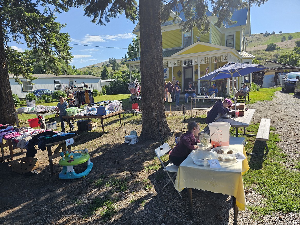 The yard in front of the J&J bed and breakfast restored Victorian home was a busy place this past weekend as dozens of shoppers checked out the items for sale during the Sanders County Yard Sale-ing event. (Chuck Bandel/VP-MI)