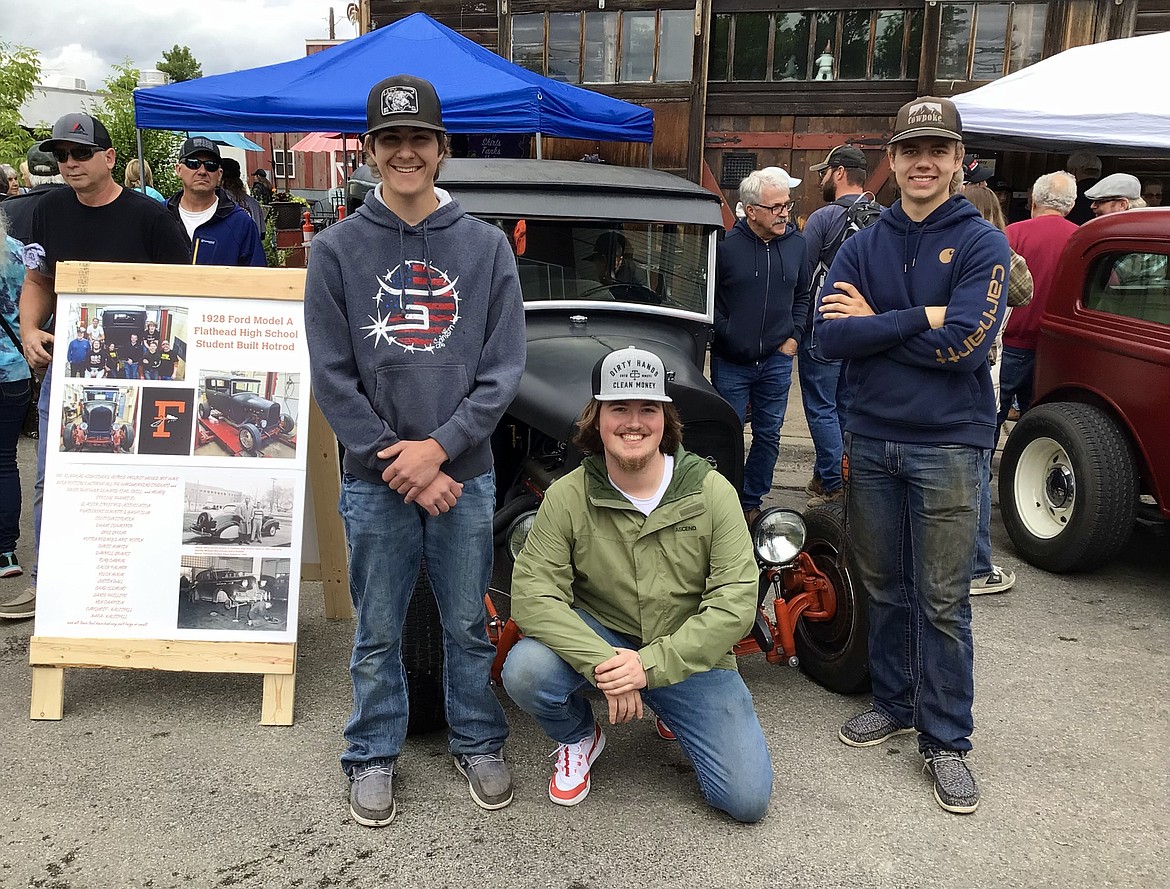 Flathead High School 2023 graduates Mason Dall, Zach Roker and Brock Sturm attend the Big Shindig car show with the 1928 Model A they had a hand in helping build in automotive teacher Rob Hunter's class on Saturday, June 17. The car show was hosted by the Glacier Street Rod Association and Desoto Grill to raise funds for Mikayla’s Miracles and Blessings Foundation, a nonprofit that provides assistance and equipment to parents or spouses of individuals with special needs. (Hilary Matheson/Daily Inter Lake)