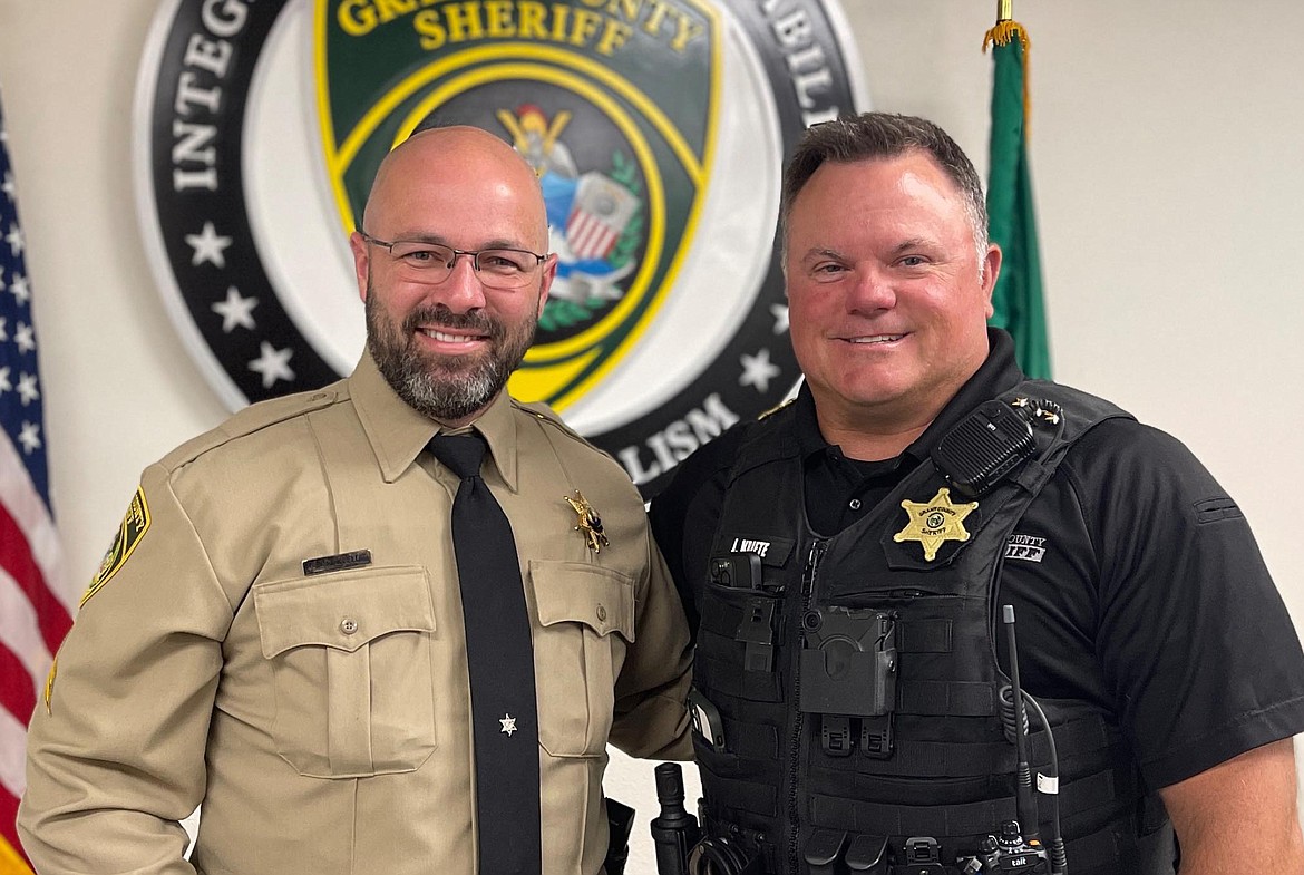 Corporal Jason McDonnell, left, was sworn in Monday morning by Sheriff Joe Kriete, right.