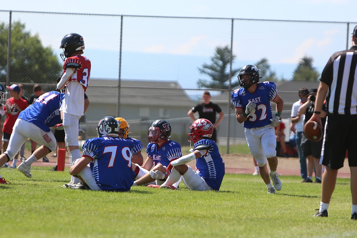 Royal running back Kaleb Hernandez (32) plays duck, duck, goose in celebration of scoring a touchdown at the Earl Barden Classic in Yakima on Saturday.