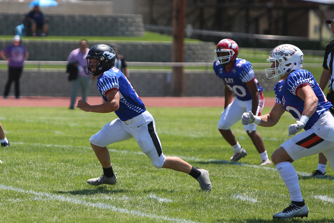 Royal linebacker Dylan Allred, left, dashes toward a West ball carrier during the first half of the Earl Barden Classic.