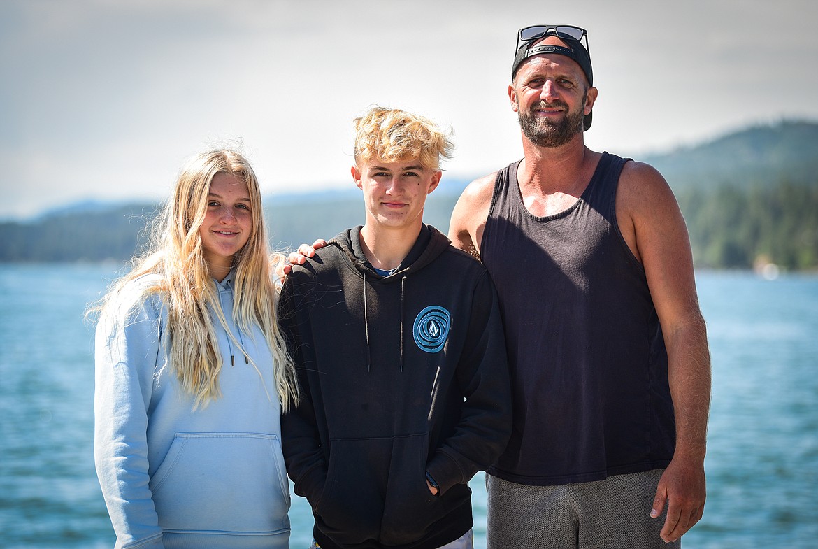 Taylor, Carson and Chris Hogan of Paddle Board Outfitters in Somers on Tuesday, June 27. (Casey Kreider/Daily Inter Lake)