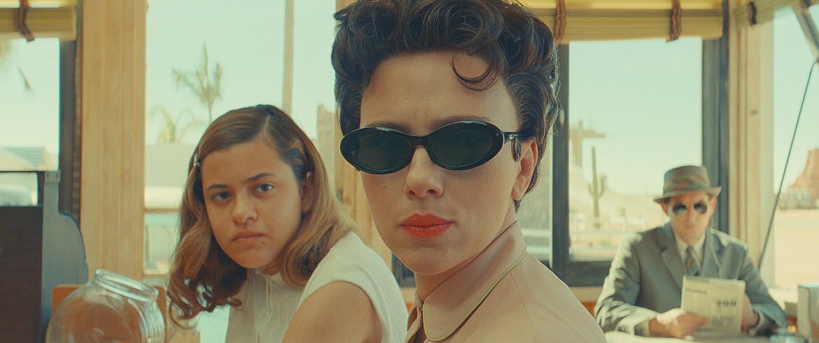 This image released by Focus Features shows, from left, Grace Edwards, Scarlett Johansson and Damien Bonnaro in a scene from "Asteroid City."