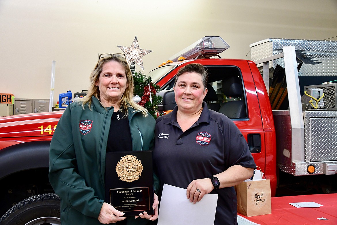 Laurie Lamont, left, and Charlotte Pegoraro are pictured here when Lamont was voted East Side Fire's Firefighter of the Year in 2021.