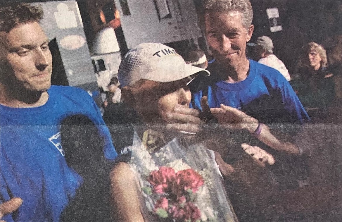 Carol Travis, of Coeur d’Alene, with husband Bill, right, persevered to the end in the first Ironman Coeur d’Alene.