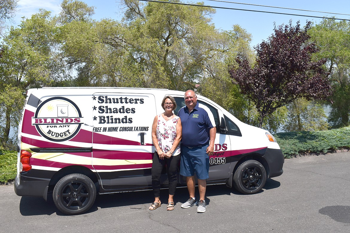 Ilene, left, and Kip Burns recently cut the ribbon on both Blinds for Any Budget and B and B Overhead Doors.