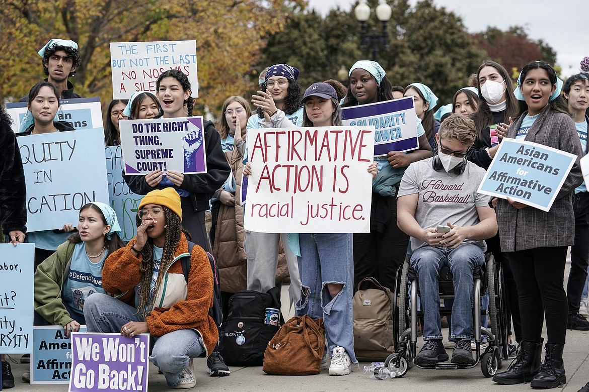 Activists demonstrate as the Supreme Court hears oral arguments on a pair of cases that could decide the future of affirmative action in college admissions, in Washington, Oct. 31, 2022. The Supreme Court ruled Thursday, June 29, 2023, that colleges and universities must stop considering race in admissions, forcing institutions of higher education to look for new ways to achieve diverse student bodies. In a 6-3 decision, the court struck down admissions plans at Harvard and the University of North Carolina, the nation's oldest private and public colleges, respectively. (AP Photo/J. Scott Applewhite, File)