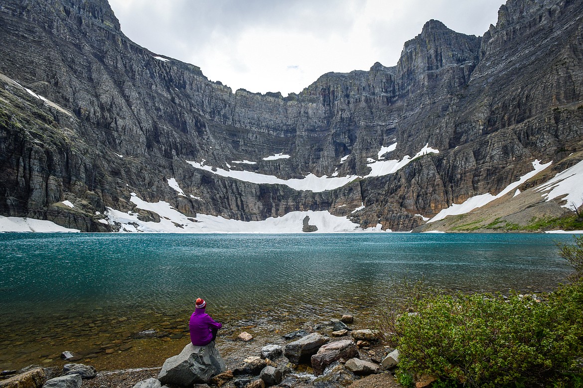 Taking in the view at Iceberg Lake in Many Glacier on Sunday, June 18. (Casey Kreider/Daily Inter Lake)
