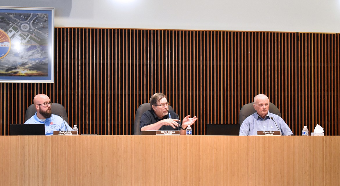 From left, Moses Lake Mayor Don Myers and City Council members David Skaug and David Eck discuss water restrictions at the Moses Lake City Council meeting Tuesday.