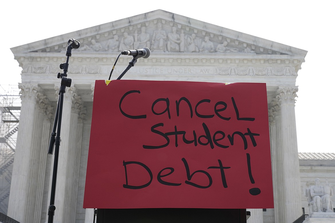 A sign reading "cancel student debt" is seen outside the Supreme Court, Friday, June 30, 2023, in Washington. A sharply divided Supreme Court has ruled that the Biden administration overstepped its authority in trying to cancel or reduce student loans for millions of Americans. Conservative justices were in the majority in Friday’s 6-3 decision that effectively killed the $400 billion plan that President Joe Biden announced last year. (AP Photo/Mariam Zuhaib)