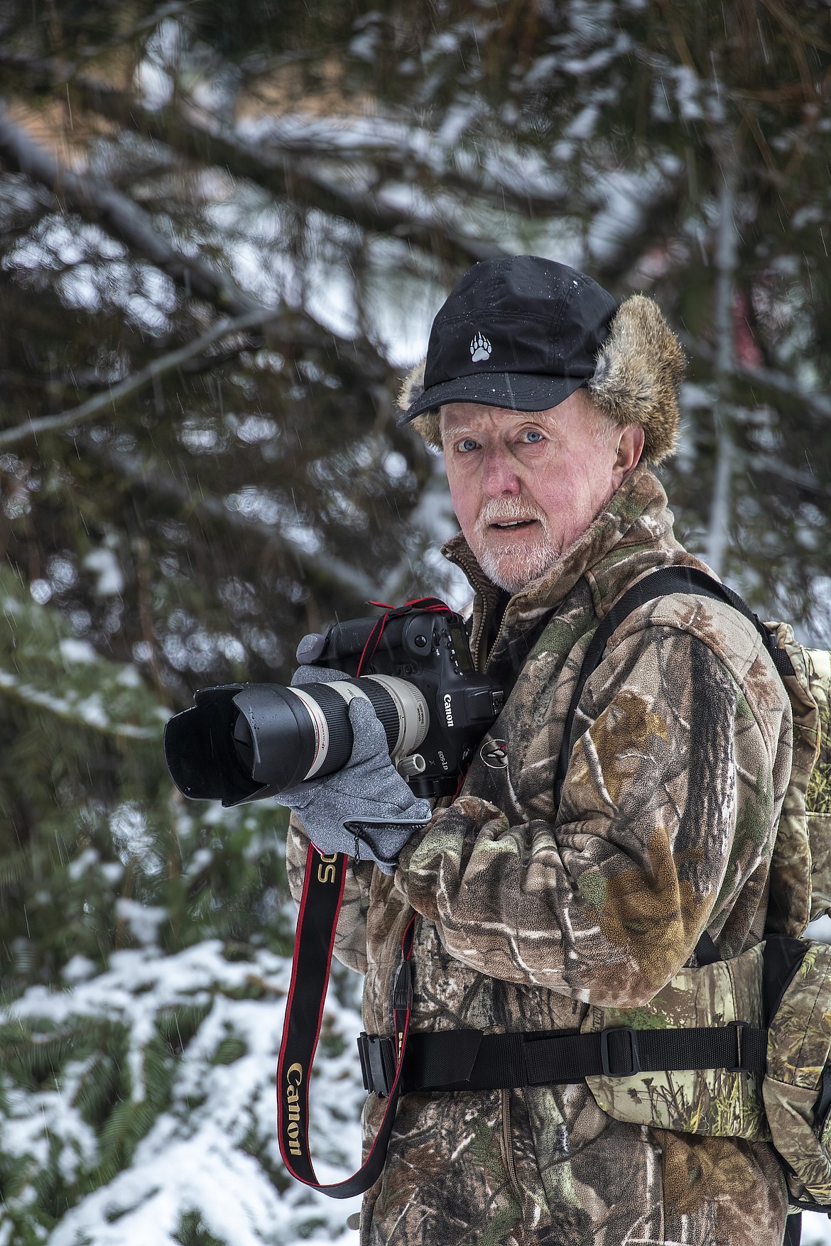 Tim Christie is dressed for photography in the outdoors.