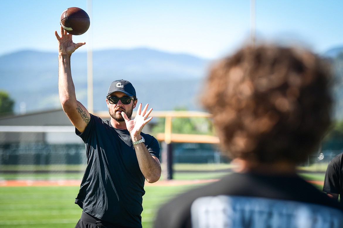 Former NFL and Flathead Braves quarterback Brock Osweiler leads quarterback drills during a pair of free football camps hosted by Osweiler at Legends Stadium in Kalispell on Saturday, July 1. (Casey Kreider/Daily Inter Lake)