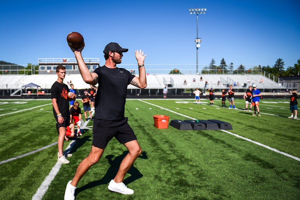 Former NFL and Flathead Braves quarterback Brock Osweiler leads quarterback drills during a pair of free football camps hosted by Osweiler at Legends Stadium in Kalispell on Saturday, July 1. (Casey Kreider/Daily Inter Lake)