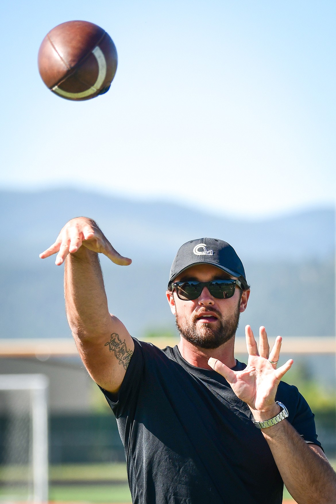 Former NFL and Flathead Braves quarterback Brock Osweiler leads quarterback drills during a pair of free football camps hosted by Osweiler at Legends Stadium in Kalispell on Saturday, July 1. (Casey Kreider/Daily Inter Lake)