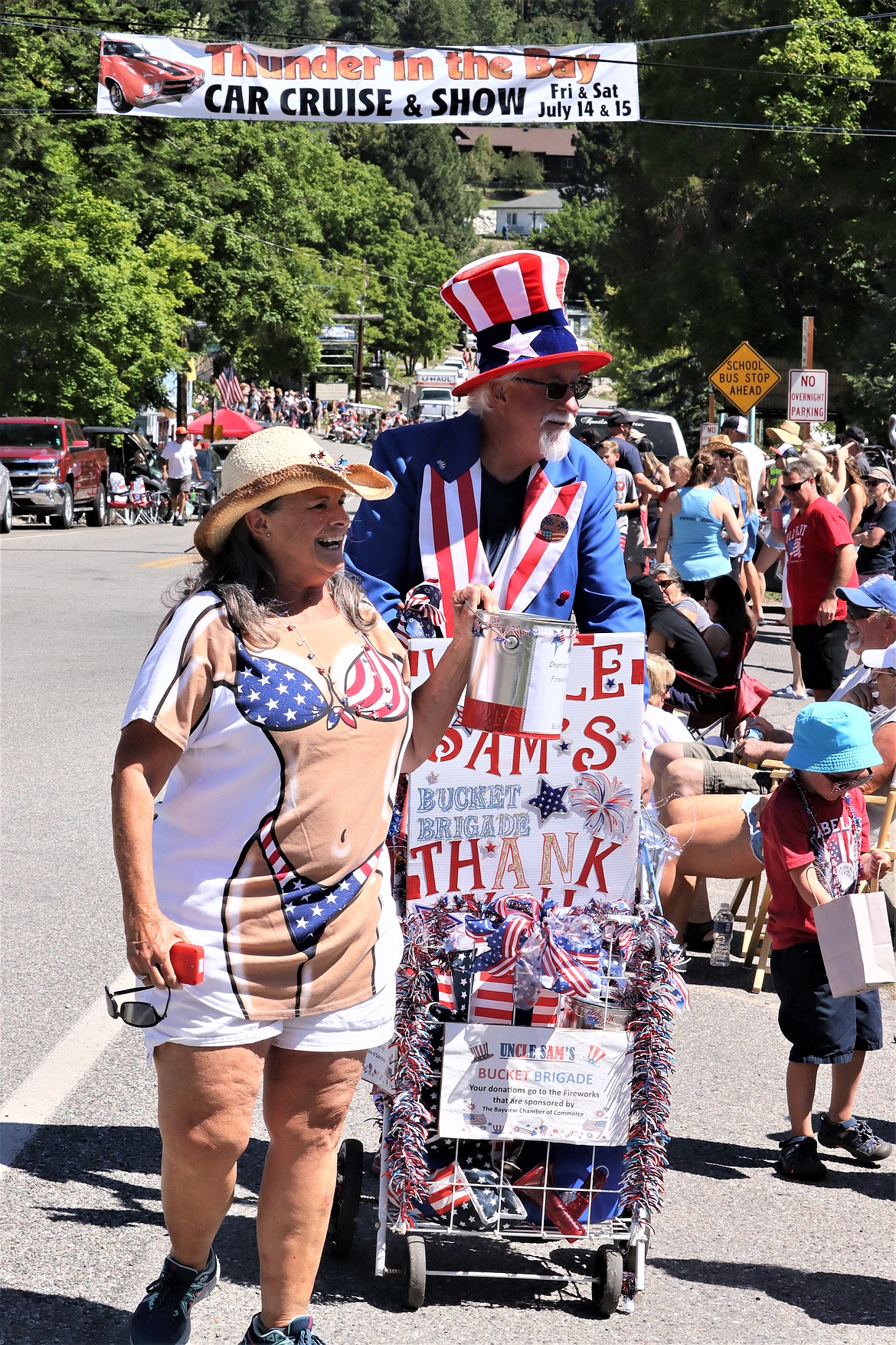 Uncle Sam's Bucket Bridge, Jamie Berube and Bob Prince, collect donations for next year's fireworks display at Bayview.