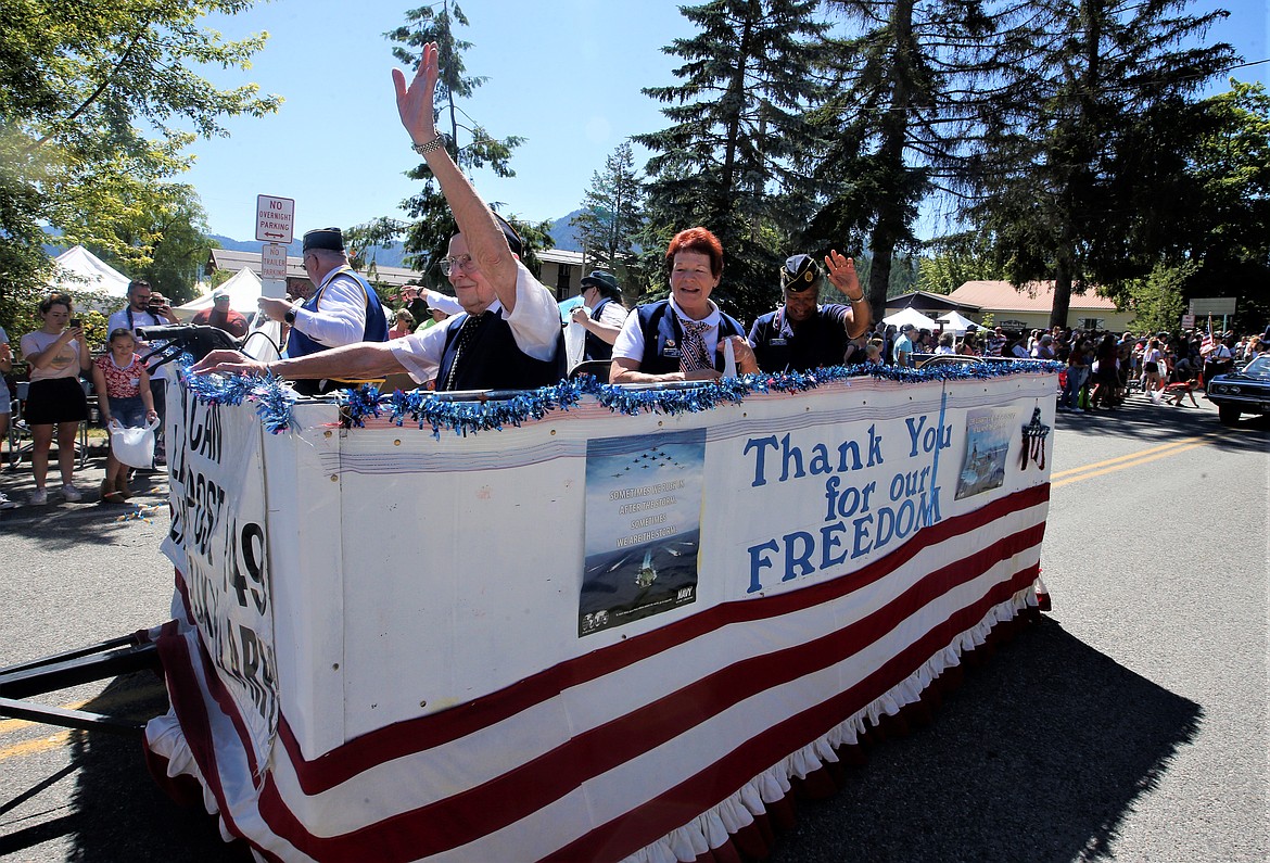 Members of the American Legion Post 149 Ladies Auxiliary wave during the Bayview Daze parade on Saturday.