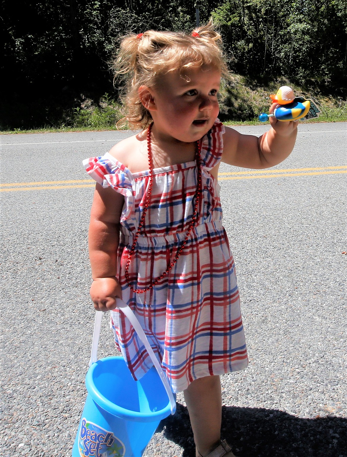 Mia Crawford shows off her ducky she received at the Bayview Daze parade on Saturday.