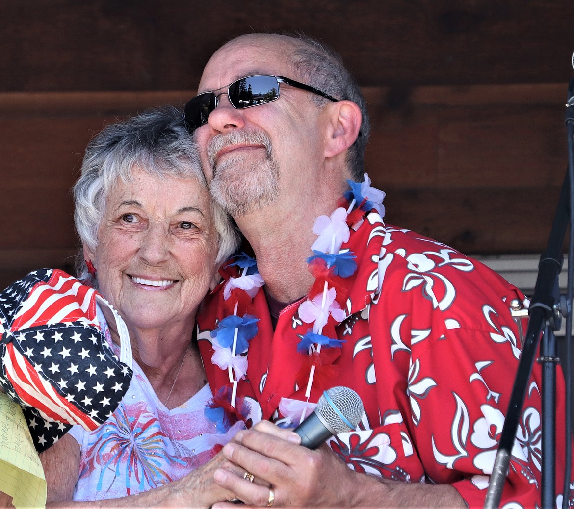 Charlene Soppit gets a hug after singing the national anthem to start the Bayview Daze parade on Saturday.