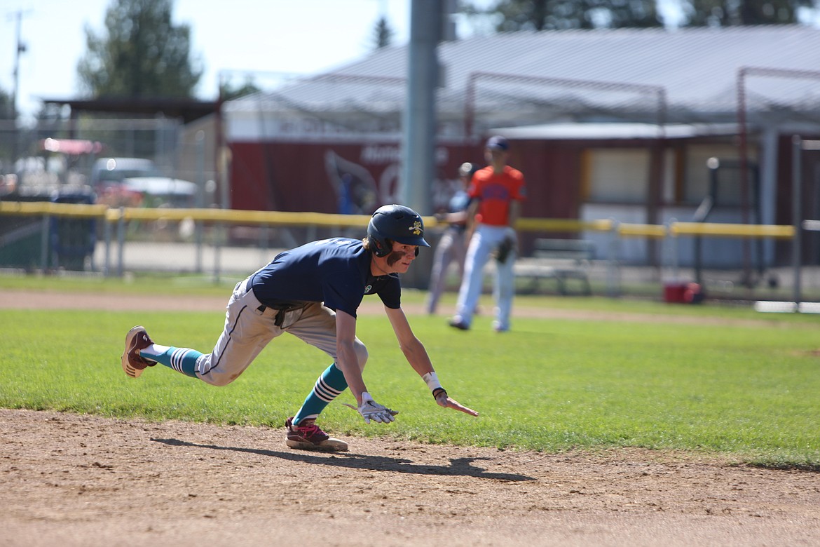 River Dog catcher Blaine Macdonald dives into third base during a game against Whatcom Post 7 in Medical Lake.