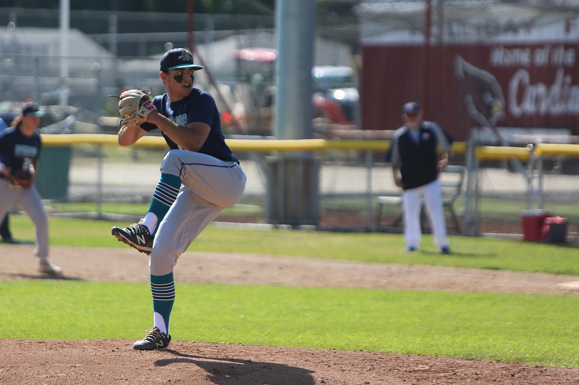 River Dog pitcher Cooper Hancock begins to pitch against Whatcom Post 7 on Friday in Medical Lake.