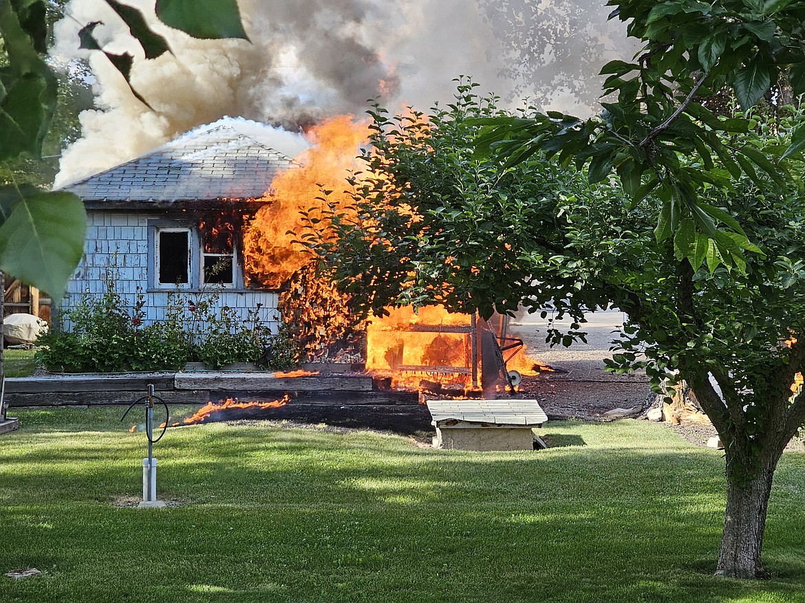 Flames engulf a garage in Plains on Friday. (Chuck Bandel/Valley Press)