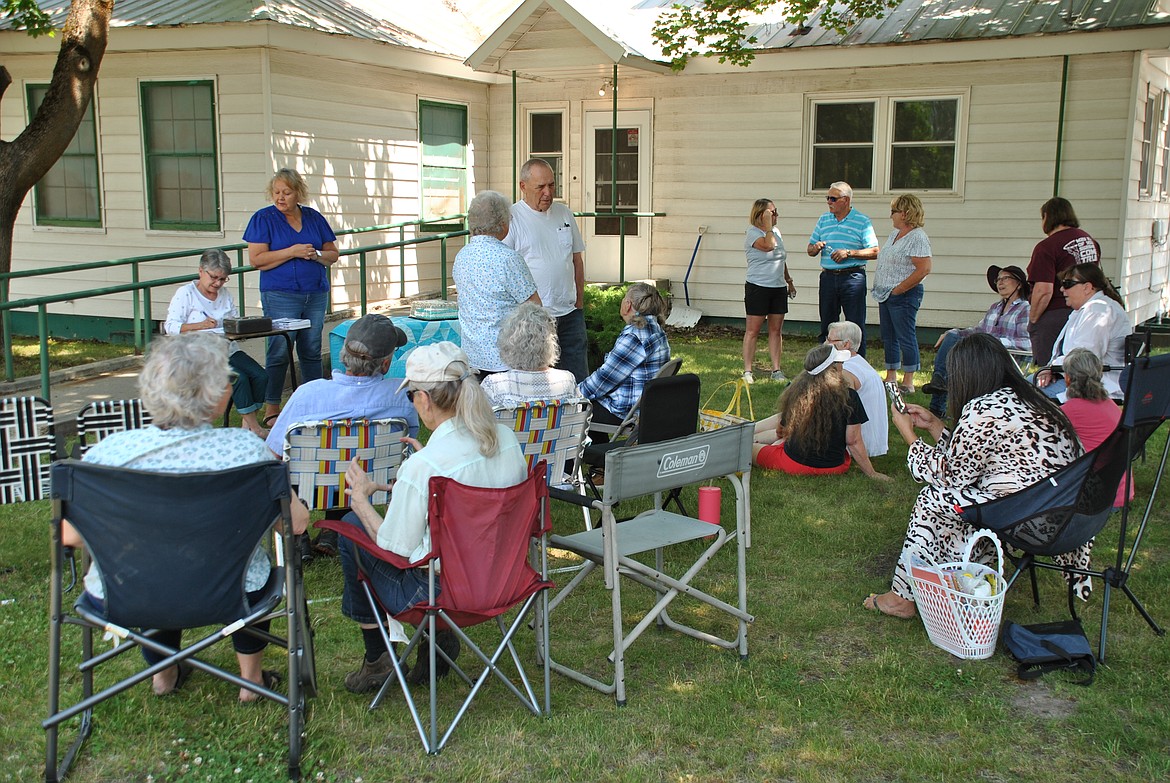 On Thursday afternoon, community members gathered at the Mineral County Library in Superior to help celebrate a brand new local author and her recently published memoir. A Boomer's Story: From the Falls, to the Mountains, and Places in Between - Life Marches on, written by longtime Superior resident, Kathryn McKinney Verley. Under the shade trees of the library lawn guests enjoyed cake, meeting the author, ordering books, and getting copies signed at the event. (Mineral Independent/Amy Quinlivan)