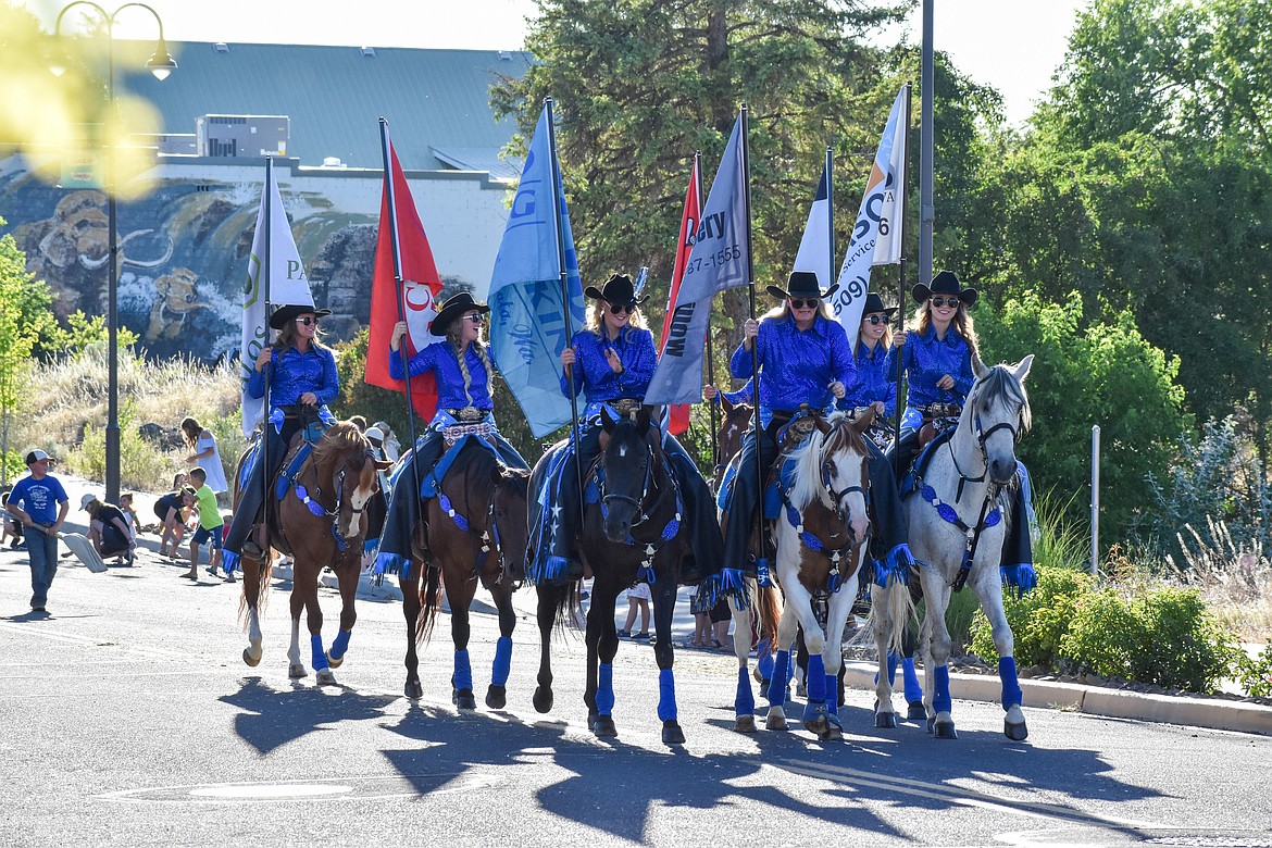 A group of women rode horses during the parade.