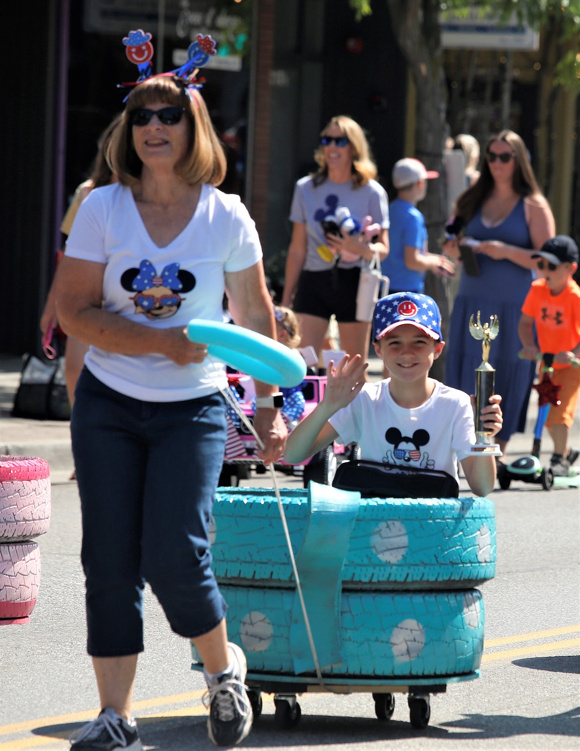 Lisa Knoll pulls Carter Knoll in the annual Kiddies Parade sponsored by the Coeur d’Alene Recreation Department on Monday. The entry won first place for floats.