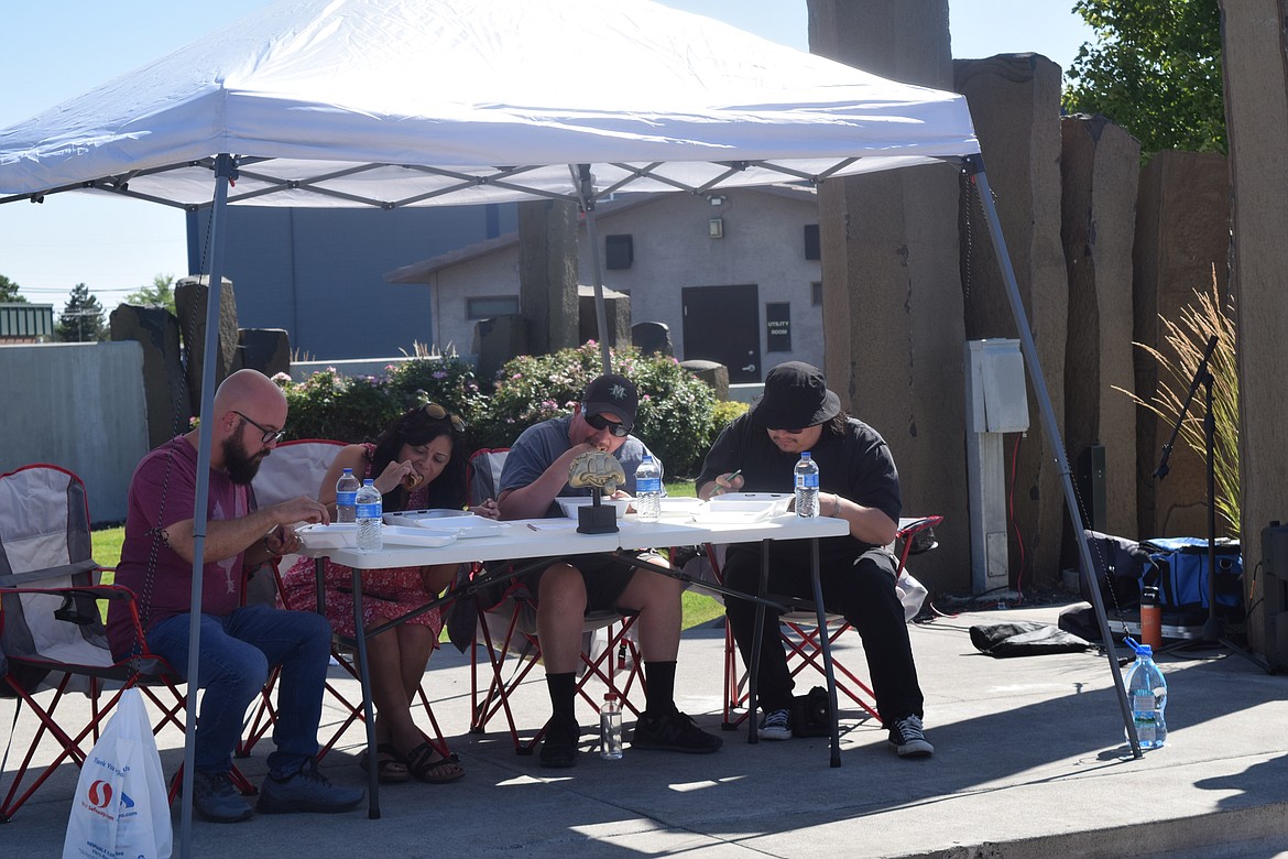 Moses Lake Mayor Don Myers, Deputy Mayor Deanna Martinez, chef Richard Paulk, and local artist Fabian Nunez, the Party on Third Avenue’s taco contest judging panel, taste test tacos from four local restaurants.