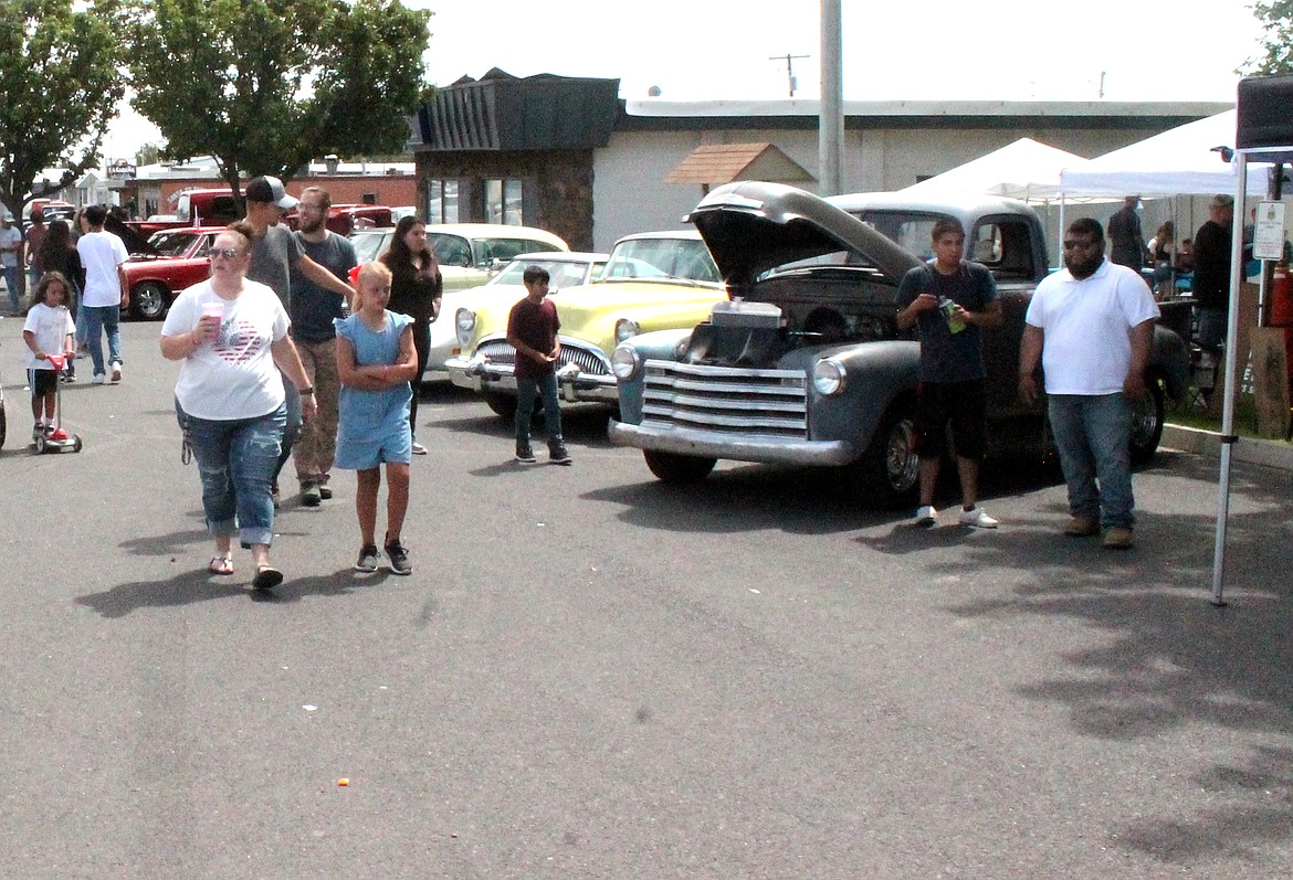 Attendees check out the car show at last year’s Summerfest in Royal City. This year the car show will be held on Friday in Lions Park.