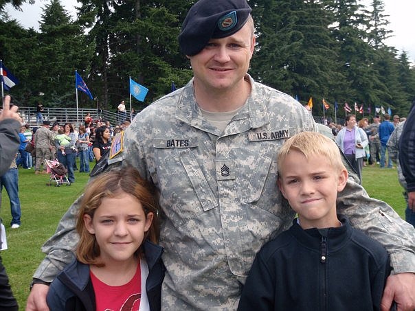 Robert Bates, a Quincy-based counselor who supports veterans throughout Grant County, served in the U.S. Army in a variety of combat deployments before retiring. Here he is as a sergeant first class with his children prior to retiring.